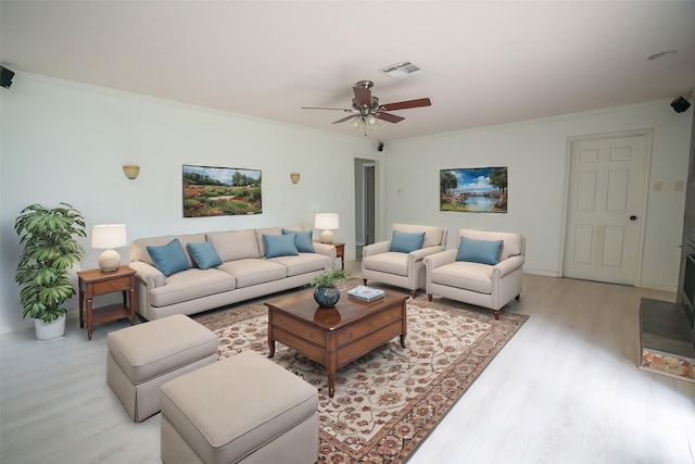 5507 W Bellfort Ave, Houston, TX 77035 - living area featuring light wood-type flooring, ornamental molding, ceiling fan, and baseboards