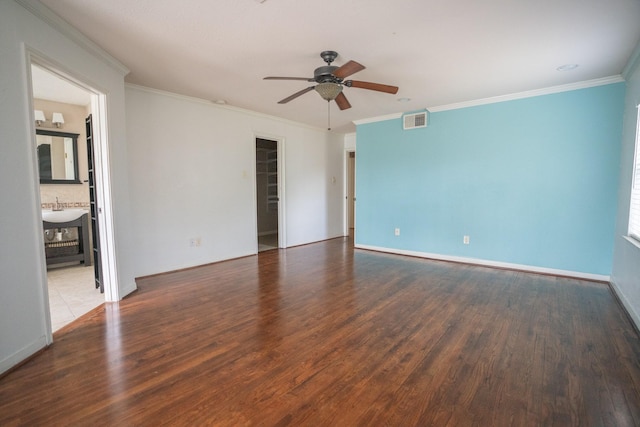5507 W Bellfort Ave, Houston, TX 77035 - empty room with ceiling fan, wood finished floors, crown molding, a sink, and baseboards
