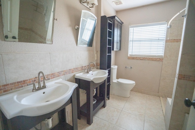 5507 W Bellfort Ave, Houston, TX 77035 - full bath featuring tiled shower, toilet, and tile patterned floors