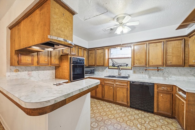 2718 Leichester Dr, Spring, TX 77386 - kitchen featuring black appliances, a sink, brown cabinetry, light countertops, and a peninsula
