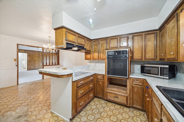 2718 Leichester Dr, Spring, TX 77386 - kitchen featuring oven, stainless steel microwave, a peninsula, under cabinet range hood, and white electric cooktop