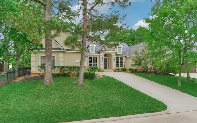 145 W Shore Dr, Montgomery, TX 77356 - view of front of home with stucco siding and concrete driveway