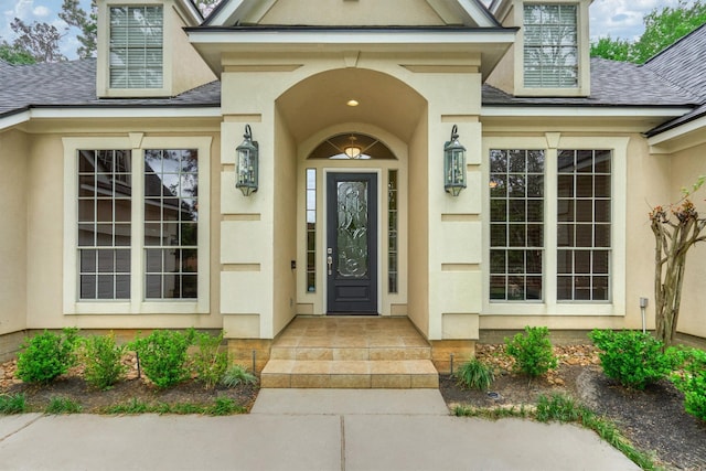 145 W Shore Dr, Montgomery, TX 77356 - doorway to property with a shingled roof and stucco siding