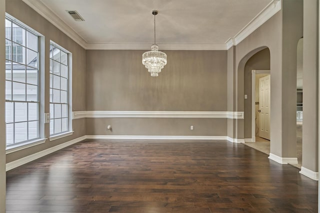 145 W Shore Dr, Montgomery, TX 77356 - spare room with arched walkways, hardwood / wood-style flooring, crown molding, a chandelier, and baseboards