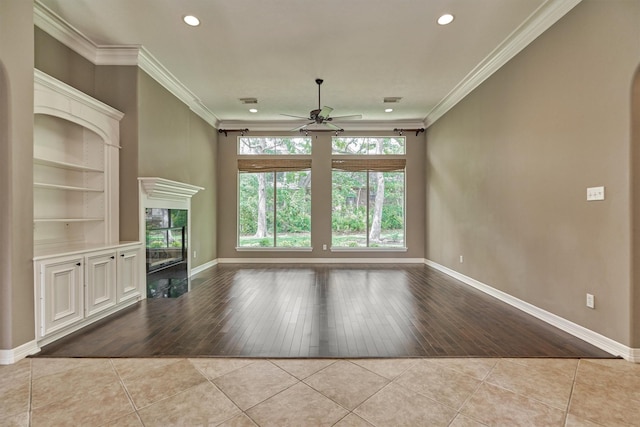 145 W Shore Dr, Montgomery, TX 77356 - unfurnished living room with ceiling fan, tile patterned floors, baseboards, built in features, and recessed lighting