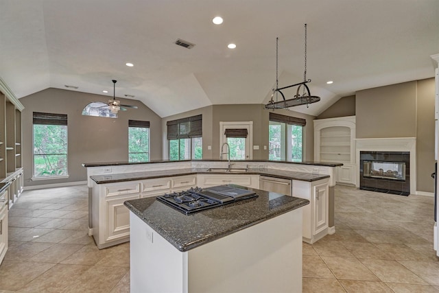 145 W Shore Dr, Montgomery, TX 77356 - kitchen with a spacious island, a sink, lofted ceiling, ceiling fan, and recessed lighting