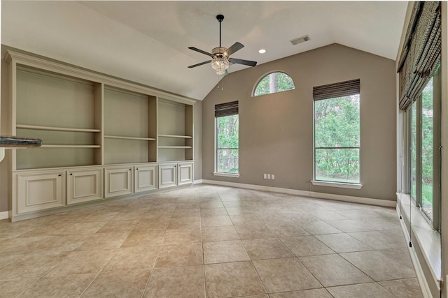 145 W Shore Dr, Montgomery, TX 77356 - unfurnished room with lofted ceiling, a ceiling fan, baseboards, and light tile patterned floors