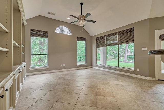145 W Shore Dr, Montgomery, TX 77356 - empty room featuring vaulted ceiling, a ceiling fan, light tile patterned floors, and baseboards