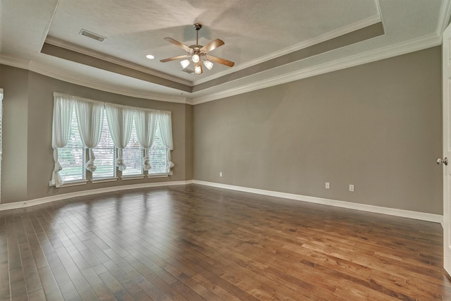 145 W Shore Dr, Montgomery, TX 77356 - unfurnished room featuring a raised ceiling, a ceiling fan, dark wood finished floors, baseboards, and ornamental molding