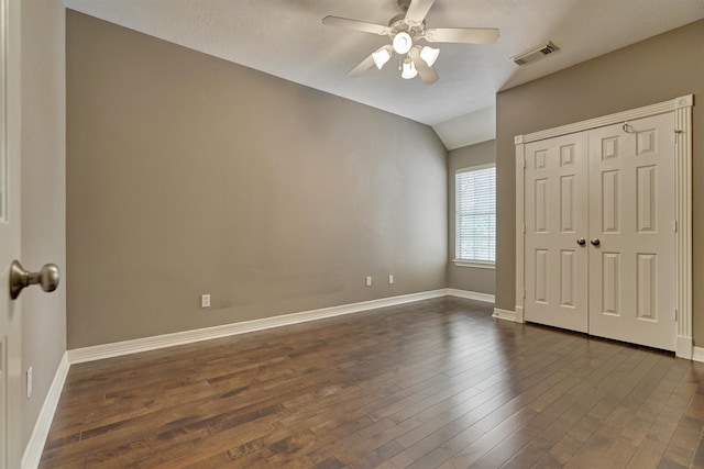 145 W Shore Dr, Montgomery, TX 77356 - unfurnished bedroom featuring vaulted ceiling, dark wood-style flooring, baseboards, and ceiling fan