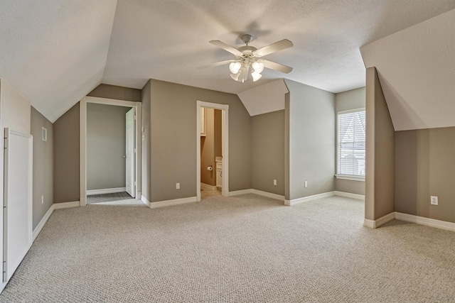 145 W Shore Dr, Montgomery, TX 77356 - additional living space featuring lofted ceiling, a ceiling fan, light carpet, and baseboards