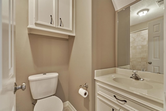 145 W Shore Dr, Montgomery, TX 77356 - full bathroom with toilet, a textured ceiling, vanity, baseboards, and a shower