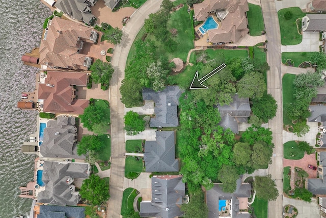 145 W Shore Dr, Montgomery, TX 77356 - aerial view of property's location with a pool and nearby suburban area