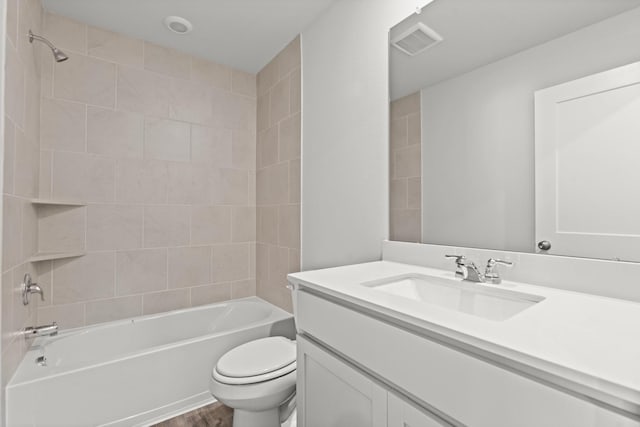 5803 Grantgrala Dr, Katy, TX 77493 - bathroom featuring toilet, vanity, shower / bathtub combination, and wood finished floors