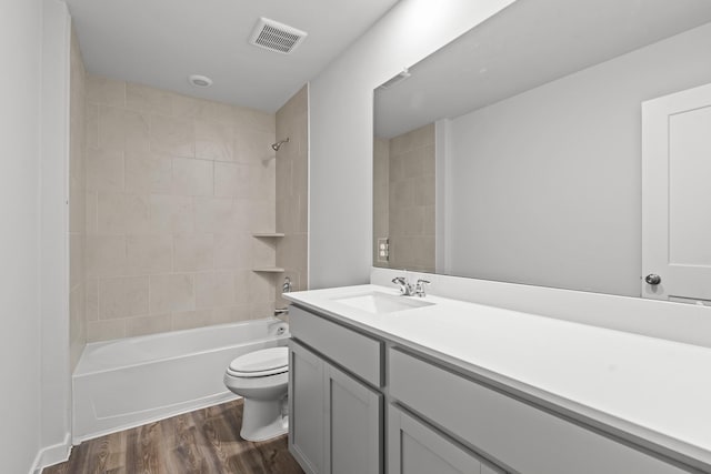 5803 Grantgrala Dr, Katy, TX 77493 - bathroom featuring toilet, wood finished floors, bathing tub / shower combination, and vanity