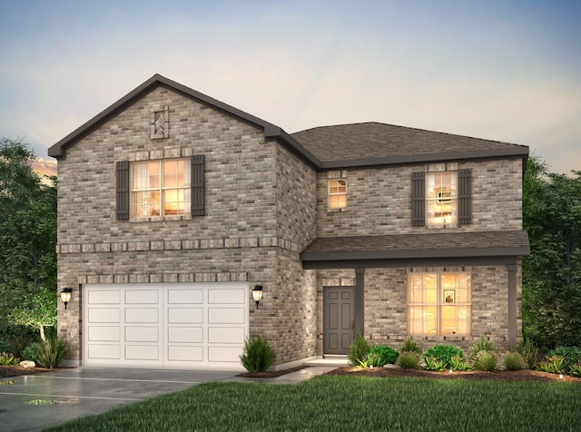 5803 Grantgrala Dr, Katy, TX 77493 - view of front of home with an attached garage, concrete driveway, a lawn, and brick siding