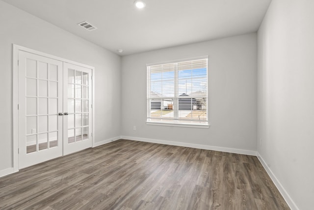 5803 Grantgrala Dr, Katy, TX 77493 - unfurnished room featuring dark wood-style flooring, french doors, and baseboards