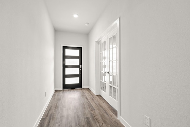 5803 Grantgrala Dr, Katy, TX 77493 - entrance foyer featuring french doors, dark wood-style flooring, and baseboards