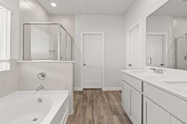 5803 Grantgrala Dr, Katy, TX 77493 - bathroom featuring a shower stall, a garden tub, wood finished floors, and double vanity