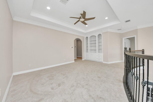 13523 Broadmeadow Ln, Houston, TX 77077 - unfurnished room featuring a tray ceiling, built in shelves, a ceiling fan, light colored carpet, and recessed lighting