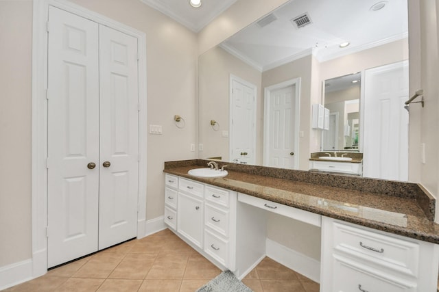 13523 Broadmeadow Ln, Houston, TX 77077 - bathroom with ornamental molding, a closet, tile patterned floors, vanity, and baseboards