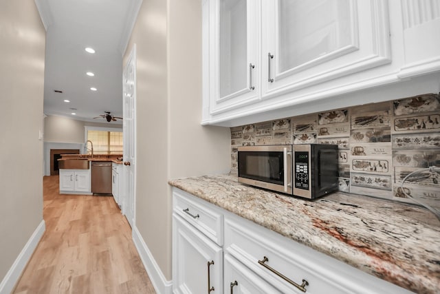 13523 Broadmeadow Ln, Houston, TX 77077 - bar area featuring stainless steel appliances, light wood finished floors, recessed lighting, baseboards, and decorative backsplash
