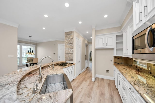 13523 Broadmeadow Ln, Houston, TX 77077 - kitchen with appliances with stainless steel finishes, crown molding, white cabinetry, recessed lighting, and a sink