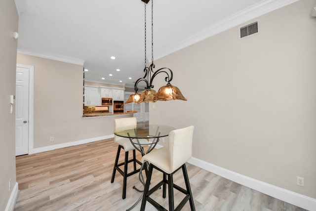 13523 Broadmeadow Ln, Houston, TX 77077 - dining space with ornamental molding, light wood finished floors, recessed lighting, and baseboards