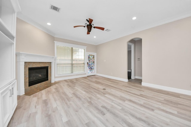 13523 Broadmeadow Ln, Houston, TX 77077 - unfurnished living room featuring a ceiling fan, light wood-style floors, baseboards, a tiled fireplace, and recessed lighting