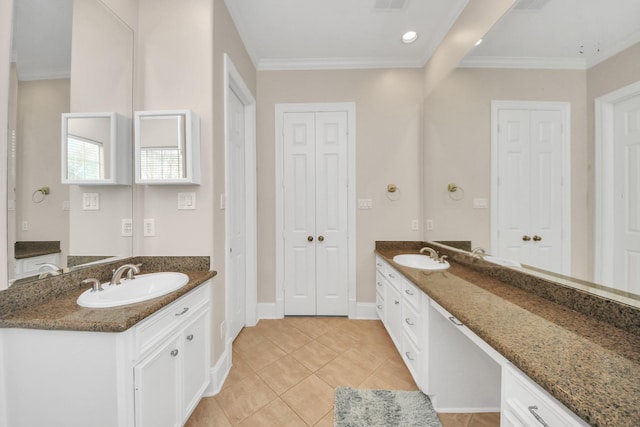 13523 Broadmeadow Ln, Houston, TX 77077 - full bath with tile patterned flooring, a closet, two vanities, ornamental molding, and baseboards