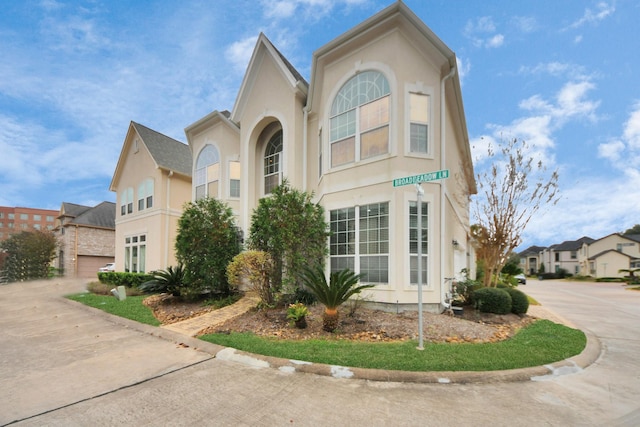 13523 Broadmeadow Ln, Houston, TX 77077 - view of front of home featuring stucco siding and driveway