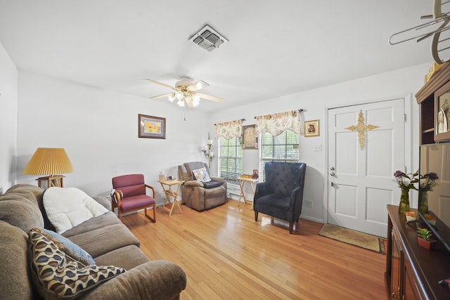 836 Sycamore St, Lake Jackson, TX 77566 - living area with a ceiling fan and light wood finished floors