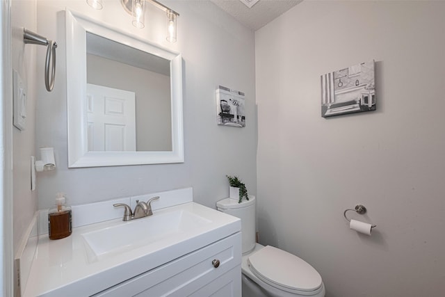 5825 Village Forest Ct, Houston, TX 77092 - bathroom with toilet, vanity, and a textured ceiling