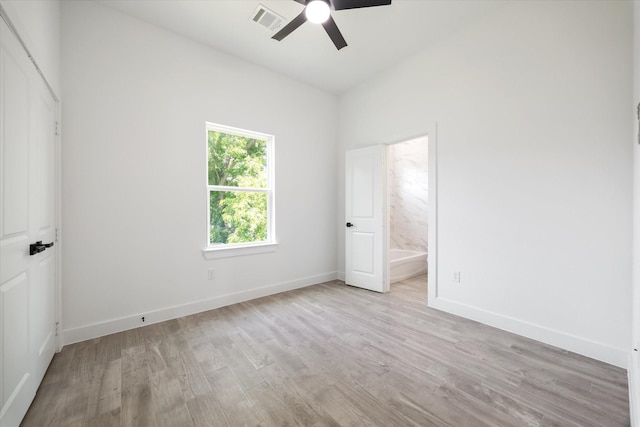 990-992 Marjorie St, Houston, TX 77088 - unfurnished bedroom featuring light wood-style flooring, baseboards, ensuite bathroom, and ceiling fan