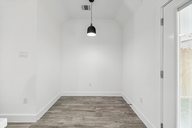 990-992 Marjorie St, Houston, TX 77088 - unfurnished dining area with vaulted ceiling, baseboards, and wood finished floors