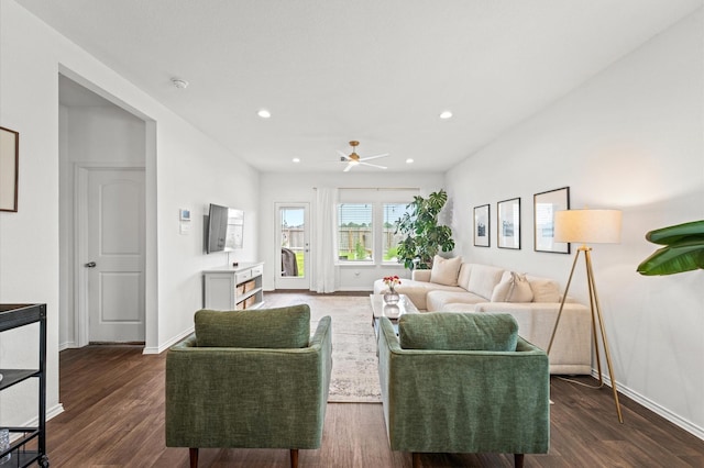 living room featuring baseboards, a ceiling fan, recessed lighting, and dark wood finished floors