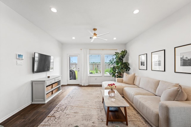 living area with baseboards, dark wood finished floors, recessed lighting, and ceiling fan