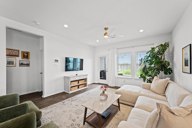 living room featuring dark wood-style flooring, baseboards, recessed lighting, and a ceiling fan