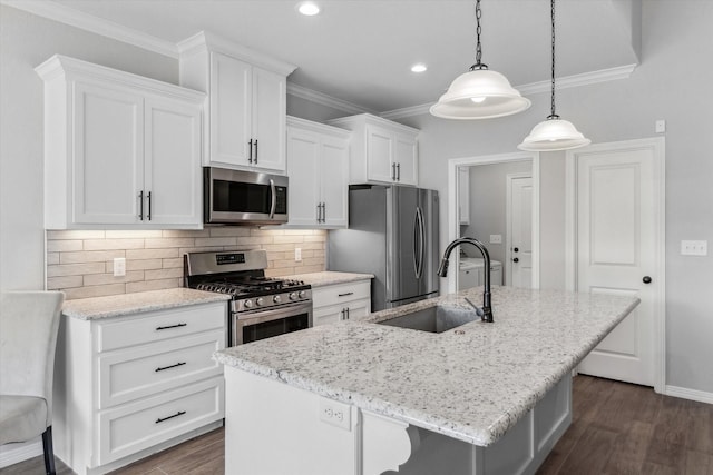 201 Patience Ave, Lindale, TX 75771 - kitchen with stainless steel appliances, a sink, white cabinetry, an island with sink, and dark wood-style floors