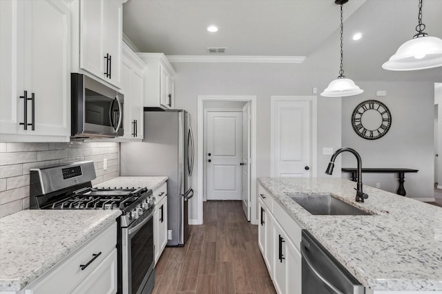 201 Patience Ave, Lindale, TX 75771 - kitchen featuring stainless steel appliances, a sink, a kitchen island with sink, white cabinetry, and decorative backsplash