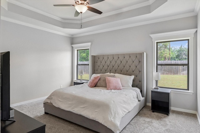 201 Patience Ave, Lindale, TX 75771 - bedroom featuring carpet flooring, a raised ceiling, ornamental molding, baseboards, and a ceiling fan