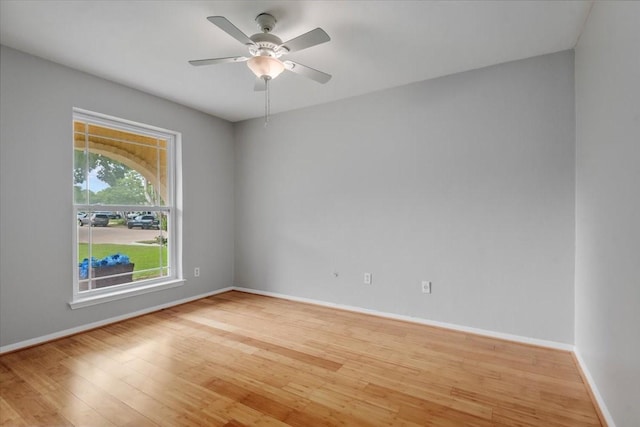 10203 Huntington Dale Dr, Houston, TX 77099 - spare room with wood finished floors, baseboards, and a ceiling fan