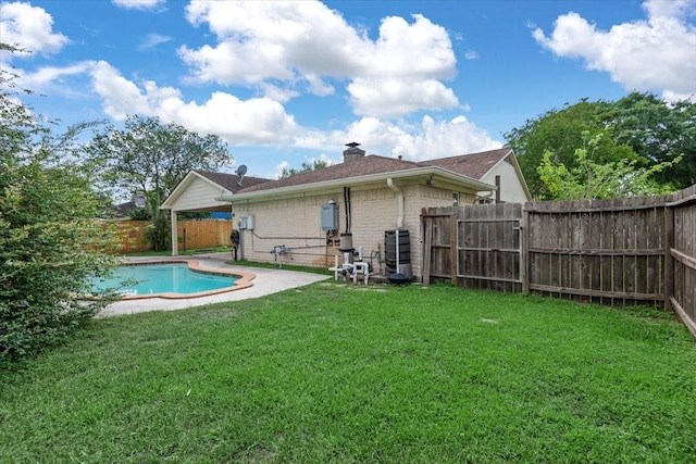 10203 Huntington Dale Dr, Houston, TX 77099 - rear view of house featuring a chimney and brick siding