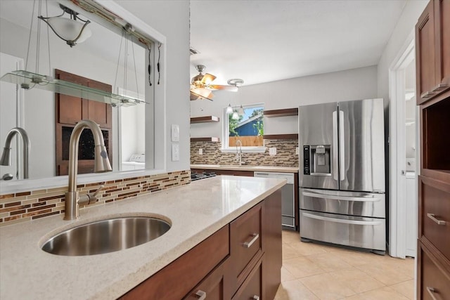 10203 Huntington Dale Dr, Houston, TX 77099 - kitchen with stainless steel appliances, a sink, open shelves, and decorative backsplash