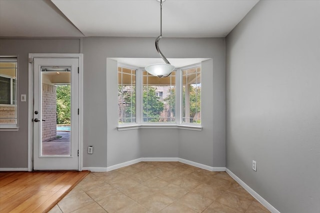 10203 Huntington Dale Dr, Houston, TX 77099 - unfurnished dining area featuring baseboards
