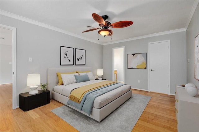 10203 Huntington Dale Dr, Houston, TX 77099 - bedroom with light wood-type flooring, crown molding, baseboards, a ceiling fan, and connected bathroom