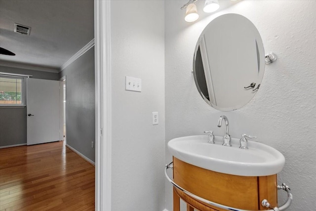 10203 Huntington Dale Dr, Houston, TX 77099 - bathroom featuring ornamental molding, wood finished floors, and baseboards
