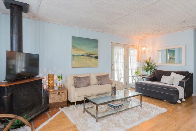 16535 Jamaica Inn Rd, Jamaica Beach, TX 77554 - living area with wood finished floors, a wood stove, and french doors