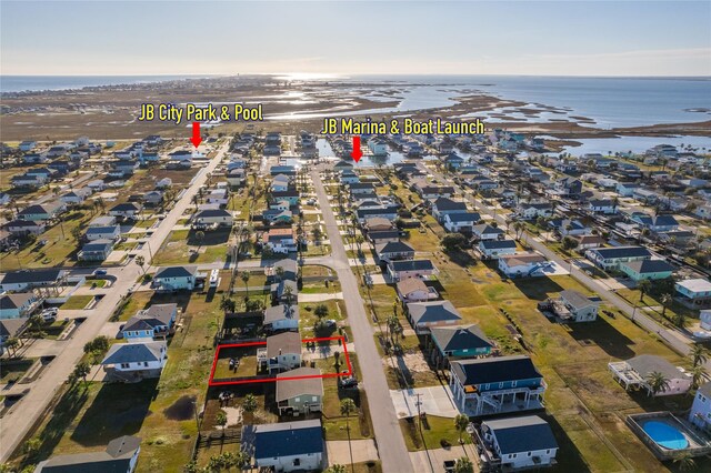 16535 Jamaica Inn Rd, Jamaica Beach, TX 77554 - aerial perspective of suburban area with a nearby body of water and property parcel outlined