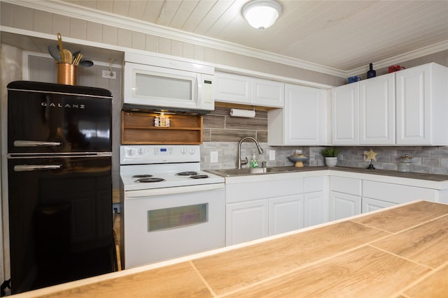 16535 Jamaica Inn Rd, Jamaica Beach, TX 77554 - kitchen with white appliances, a sink, ornamental molding, decorative backsplash, and white cabinets